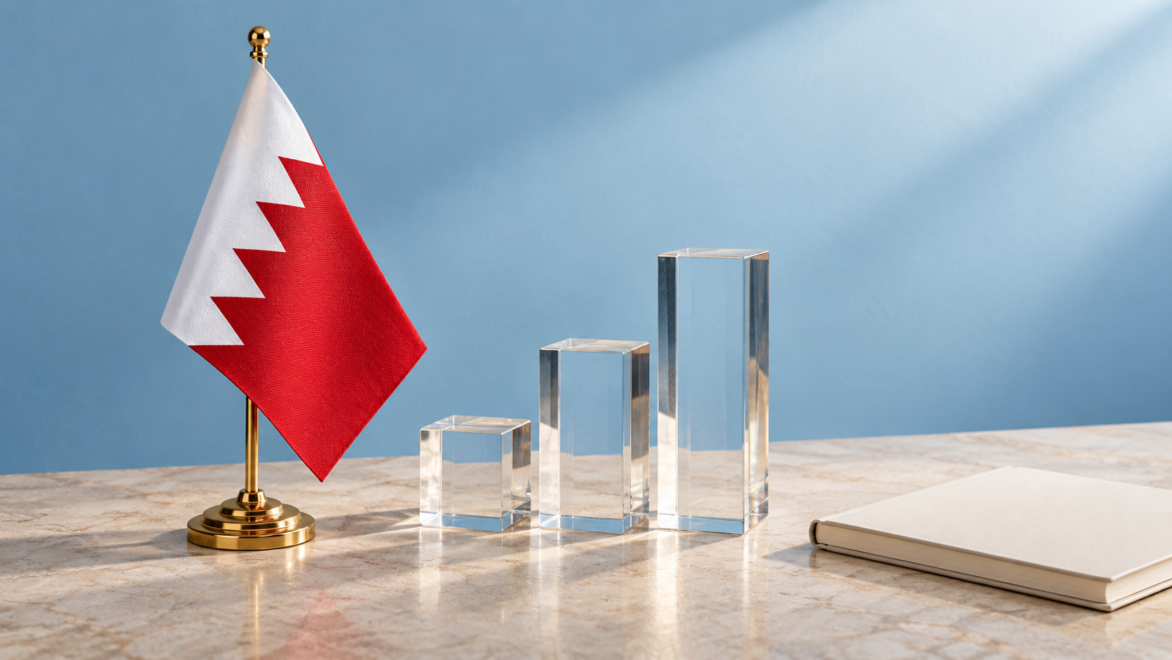 Bahrain flag beside rising glass blocks and a notebook