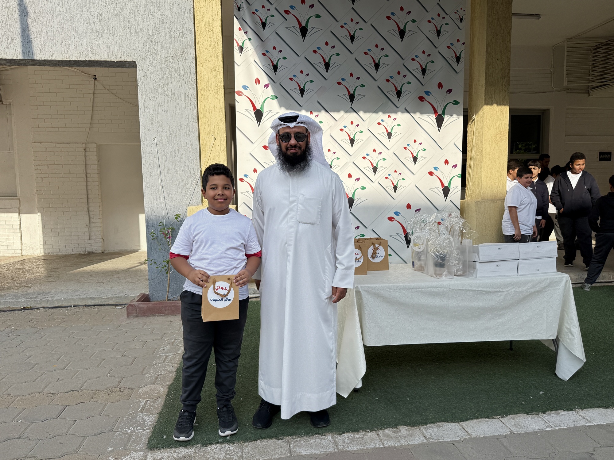 A teacher and students during World Teachers’ Day celebrations in Kuwait.