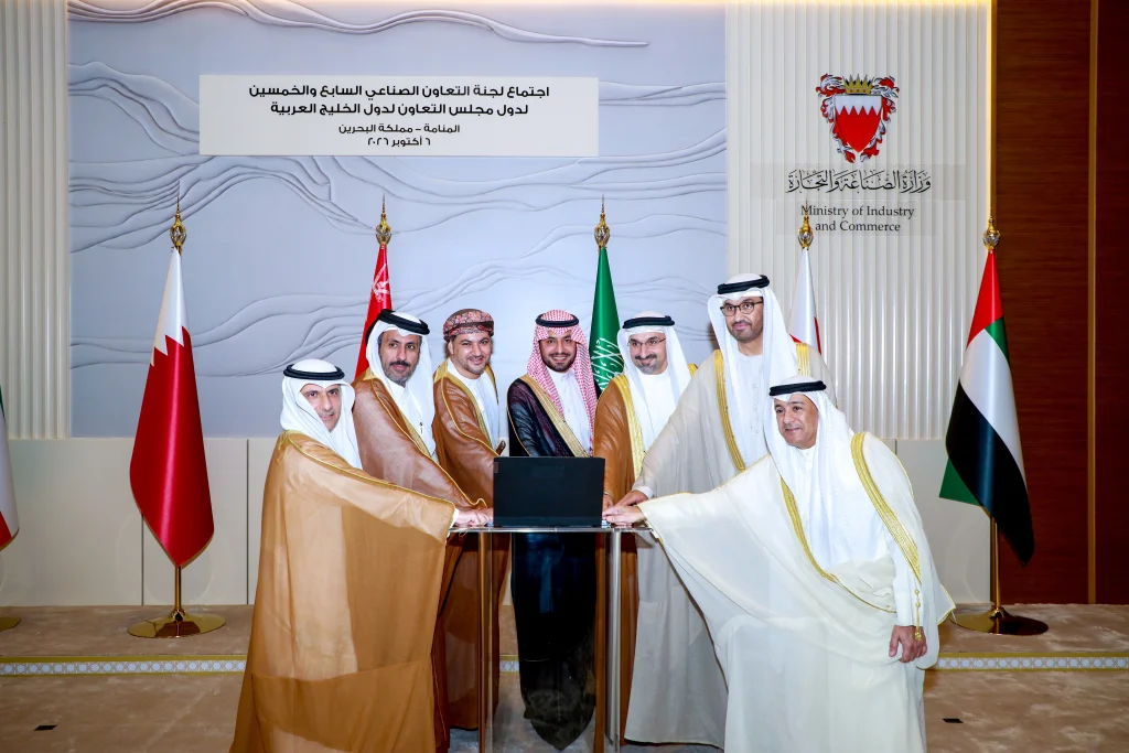 GCC representatives gathered around a laptop at the Bahrain ministerial meetings