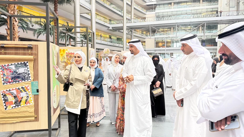 Exhibition participants discuss artworks displayed at Kuwait’s Ministry of Education