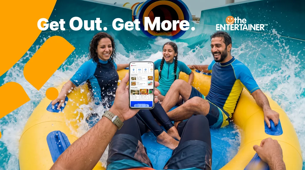 A family enjoying a waterpark in the ENTERTAINER Bahrain campaign artwork