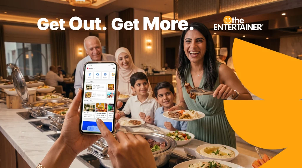 A family at a buffet in the ENTERTAINER Bahrain campaign artwork