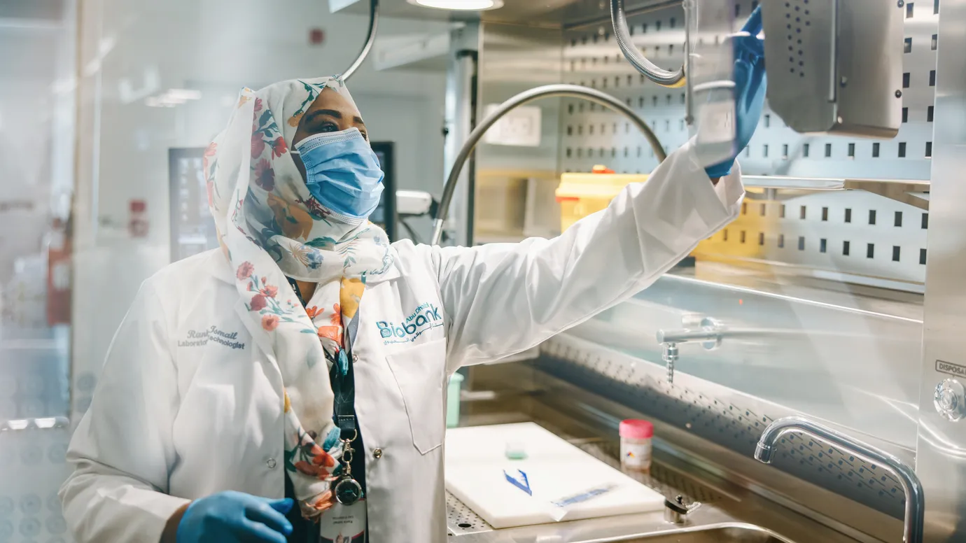 Laboratory professional at Abu Dhabi Biobank in the official image accompanying the collaboration announcement