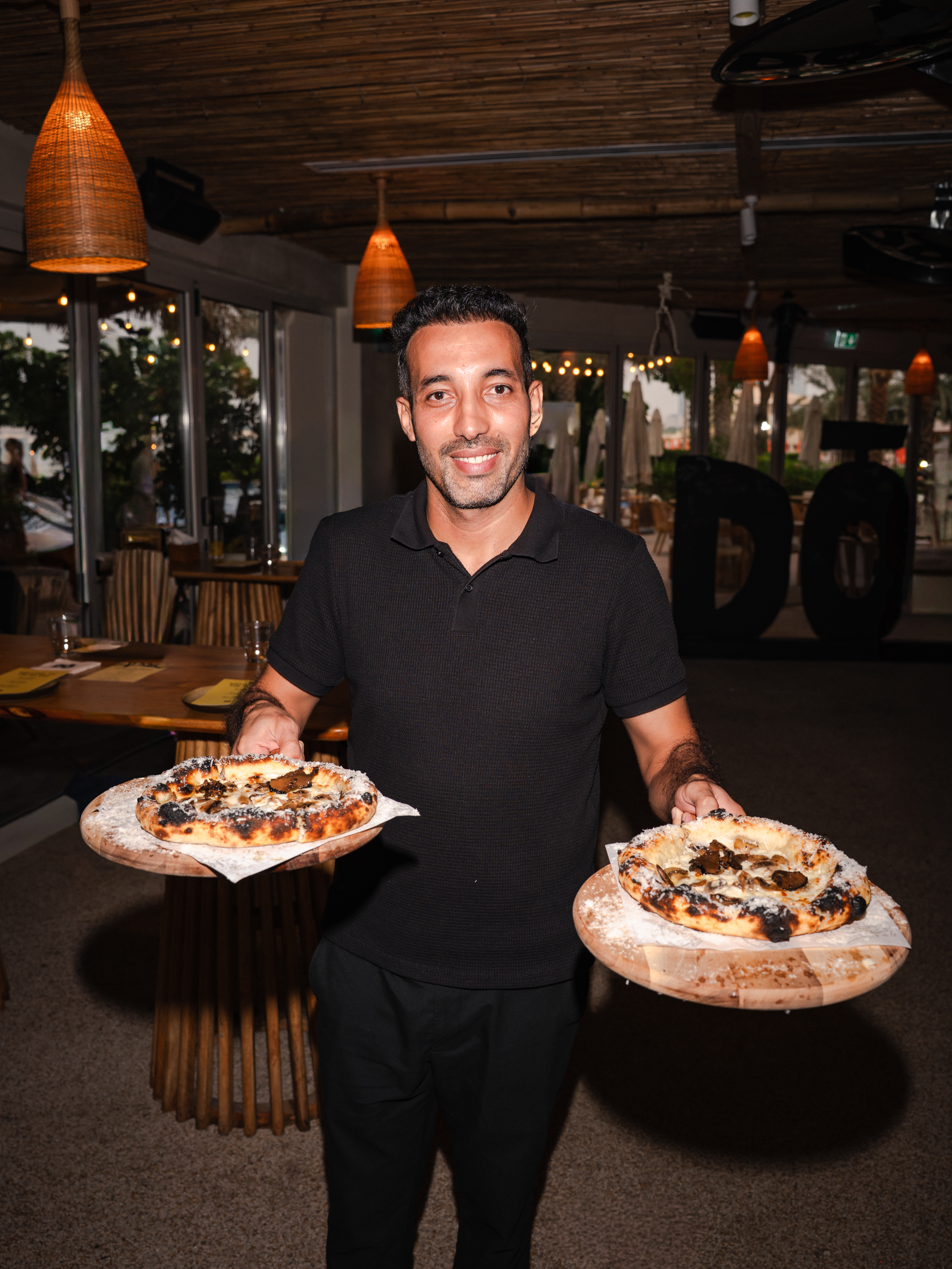 Two pizzas presented during the DŌ launch at Peaches & Cream in Dubai