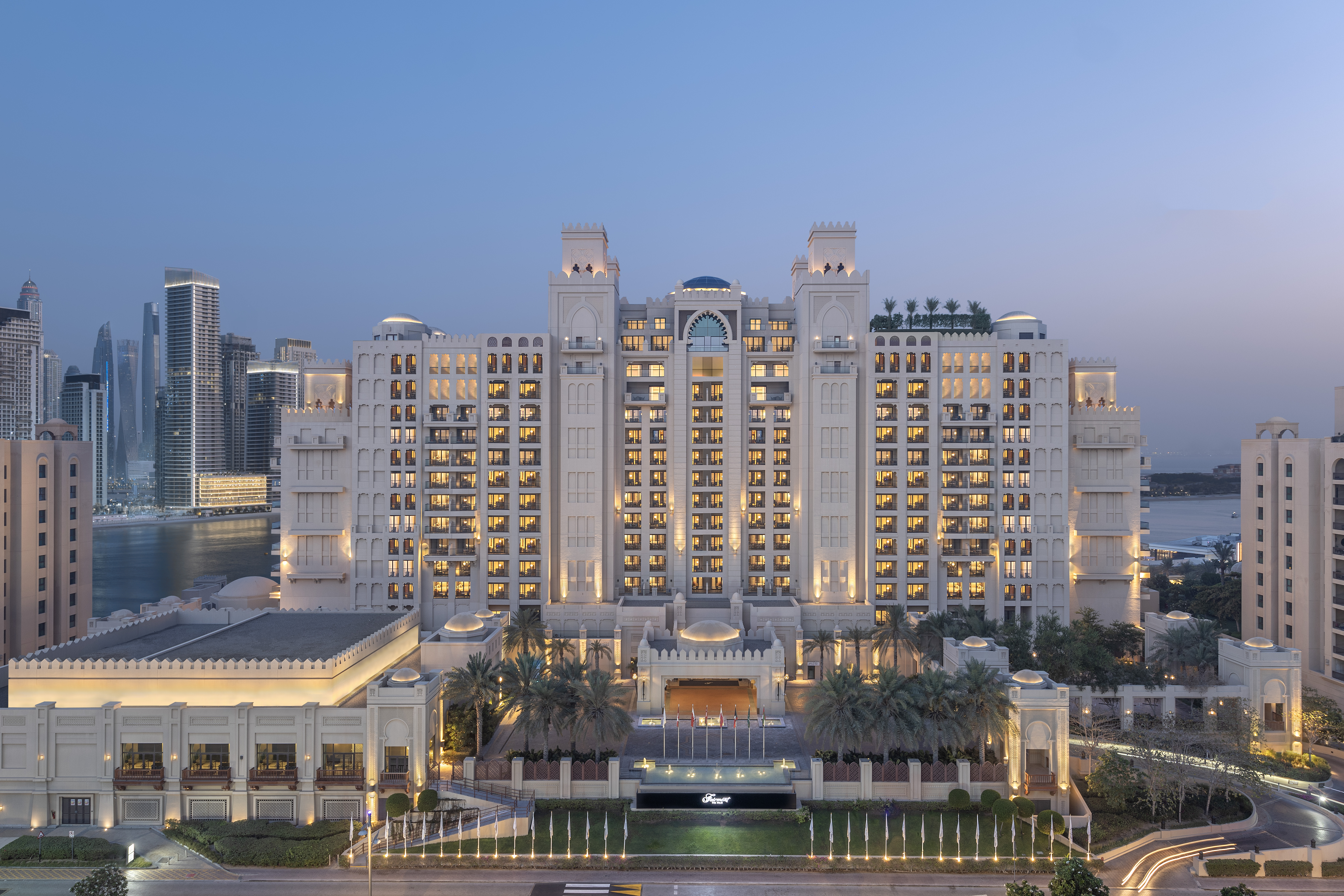 Fairmont The Palm hotel exterior at dusk