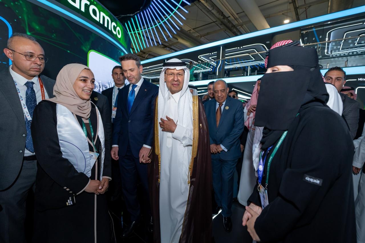 Participants and delegates in conversation at an energy exhibition booth, in a photograph supplied by Mawhiba