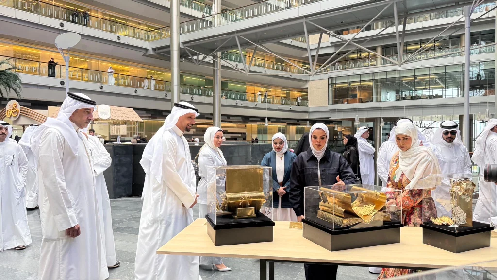 Ministry visitors examine display cases during Kuwait’s Irth education exhibition