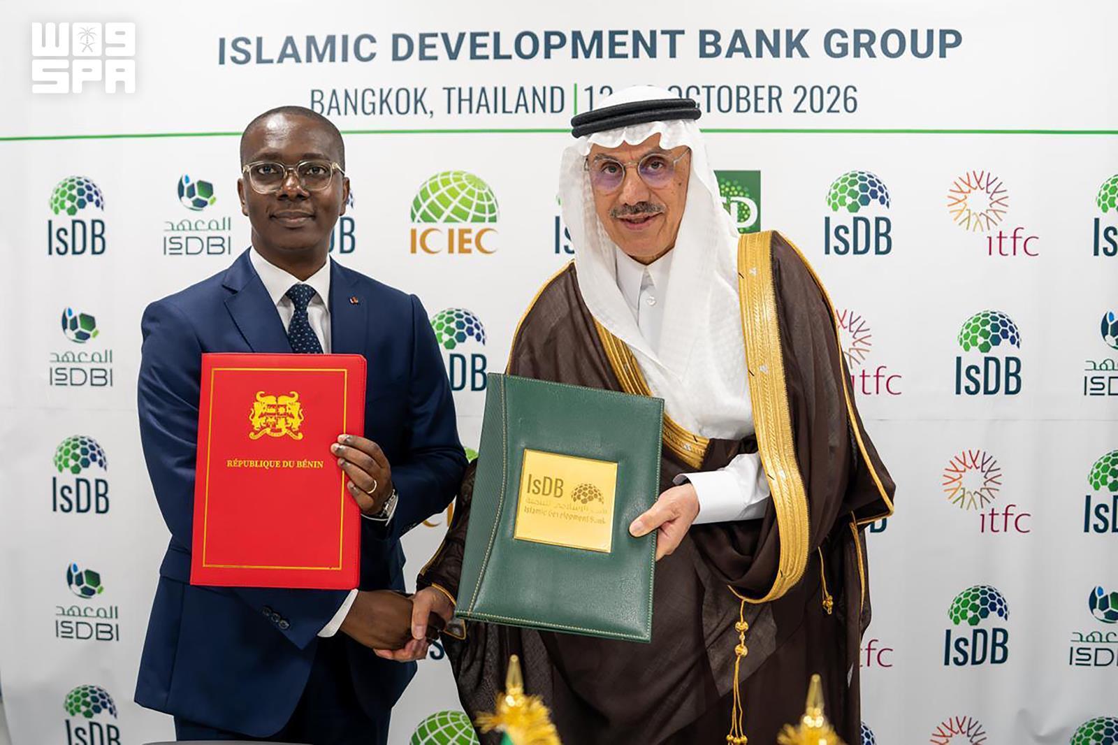IsDB and Benin representatives holding financing agreements in the official SPA photograph