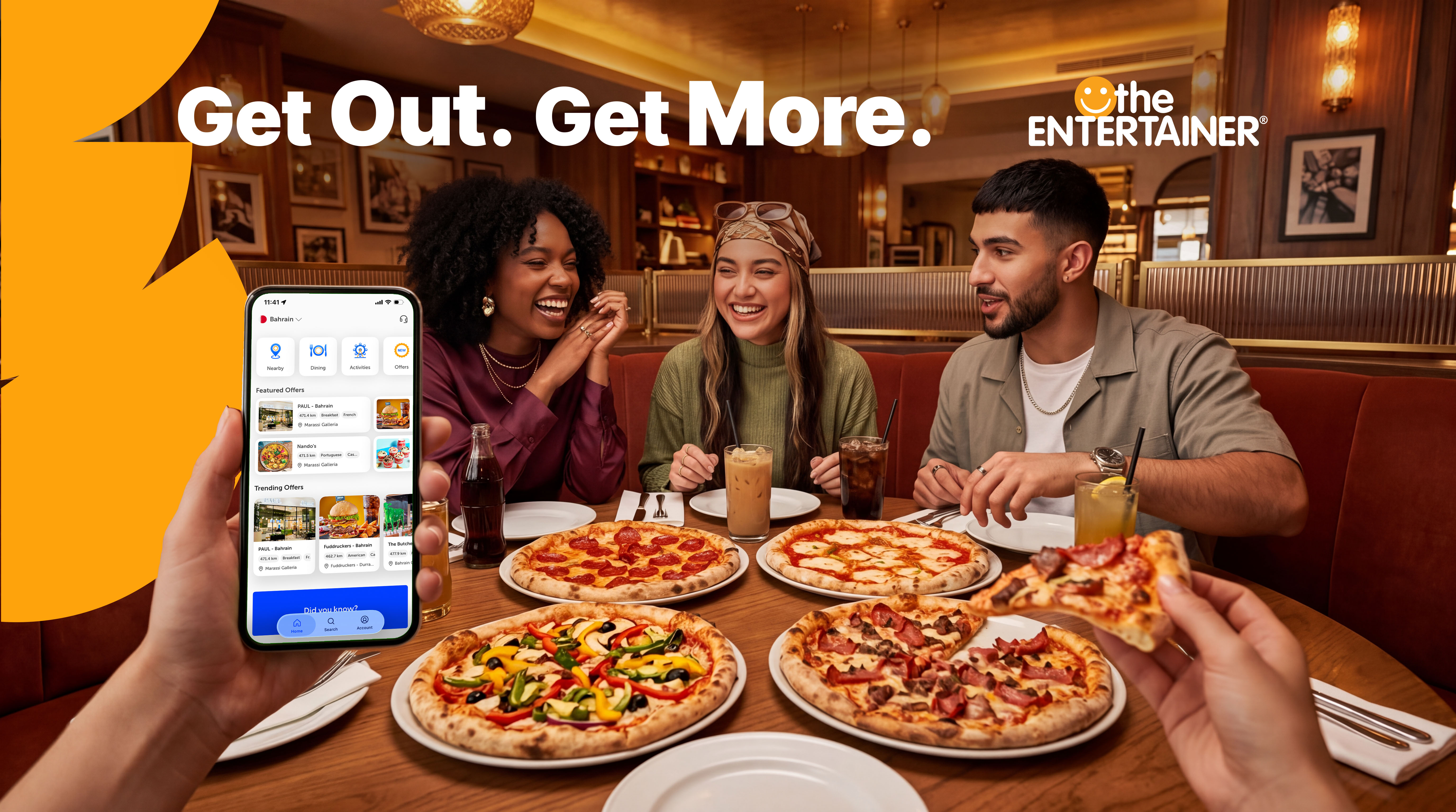 Friends dining with pizza in the ENTERTAINER Bahrain campaign artwork