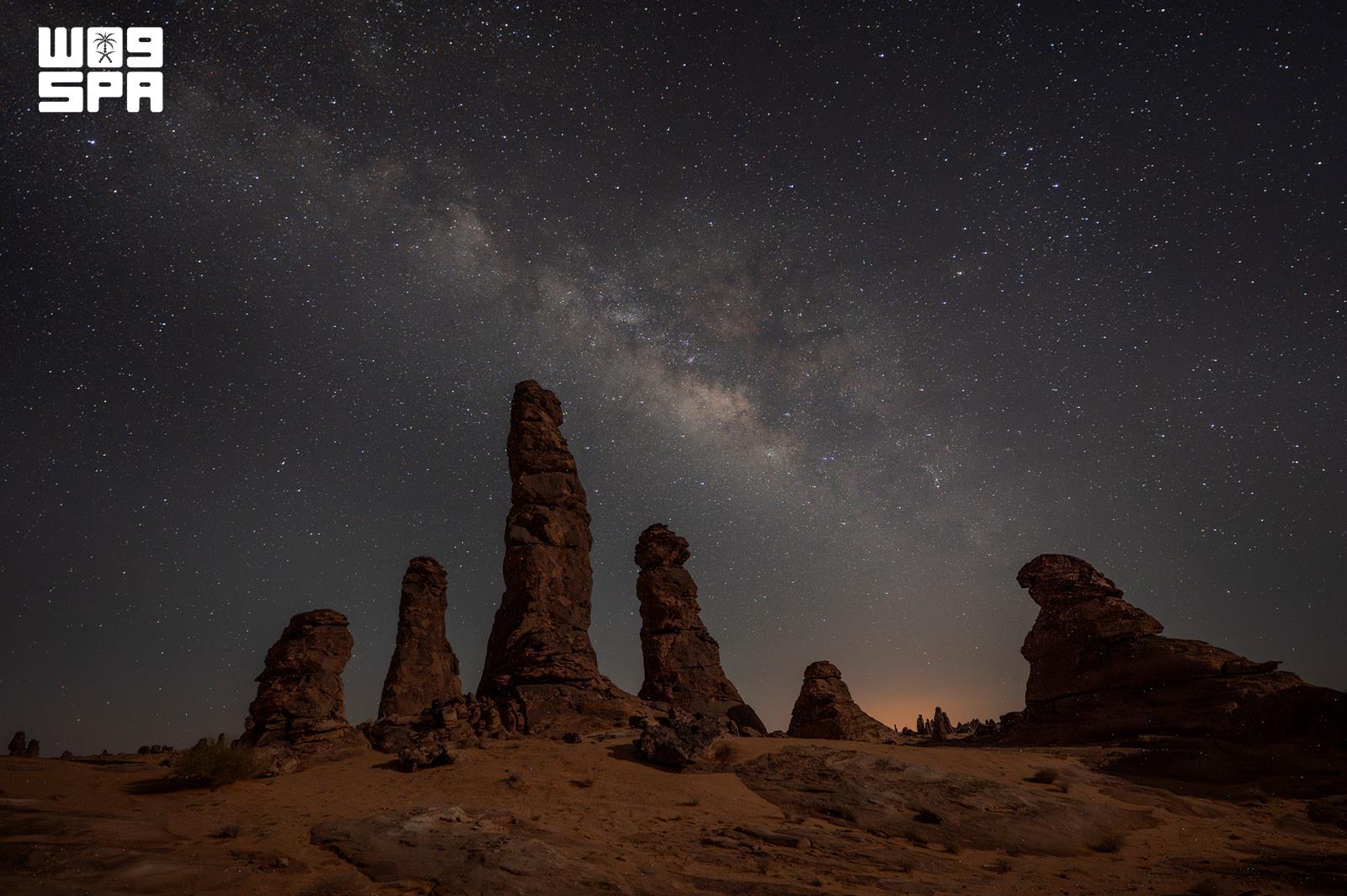 The night sky above rock formations in AlUla