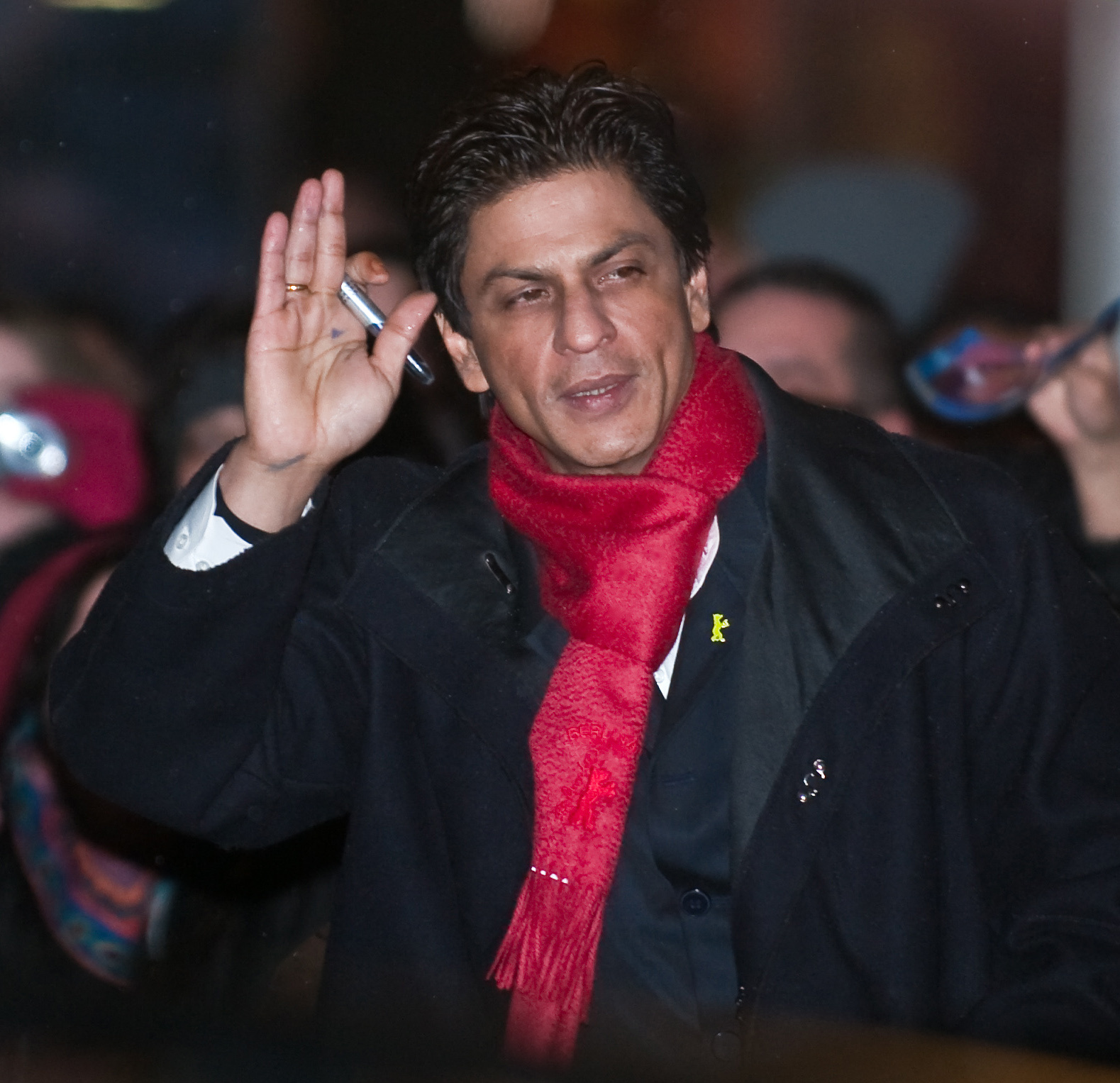 Shah Rukh Khan leaving a Berlin press conference on 12 February 2010