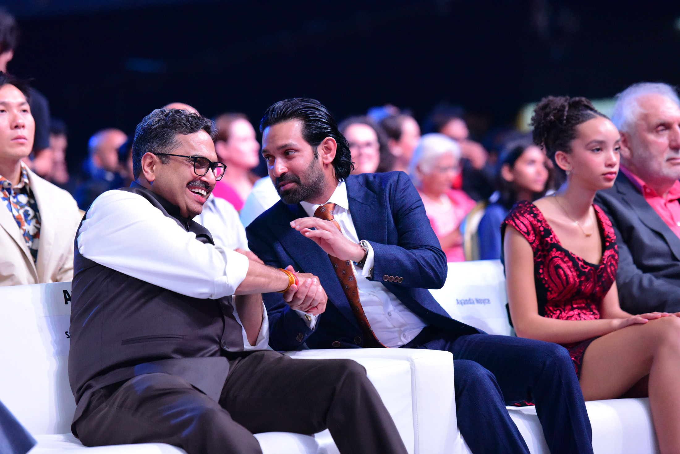 Vikrant Massey and Sanjay Jaju seated at the IFFI closing ceremony
